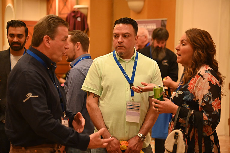 CBD American Shaman Franchise conference attendees mingling with Vince