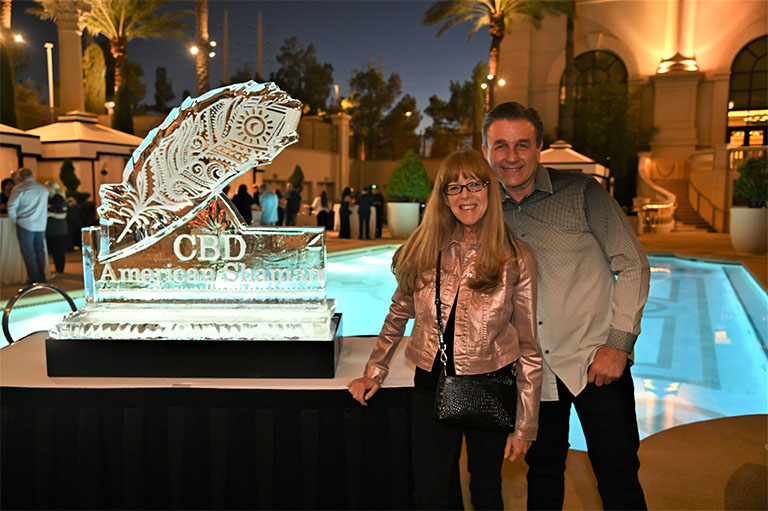 Vince posing for a photo next to the CBD American Shaman Franchise ice sculpture